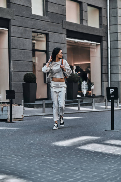 fashionable brunette woman walking - Valokuva, kuva