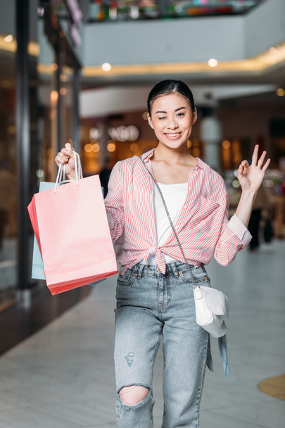 stylish woman with shopping bags - Фото, зображення