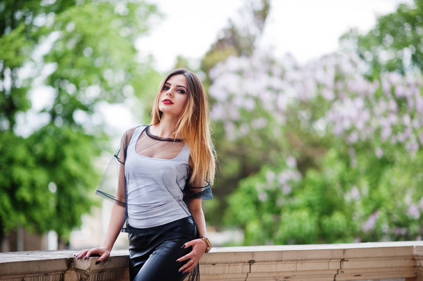 Fashionable woman look at white shirt, black transparent clothes - Photo, image
