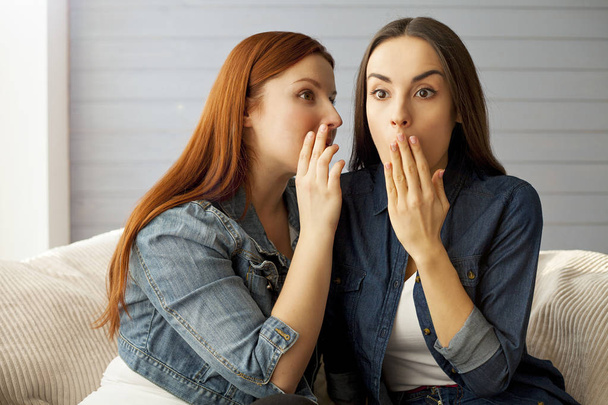 woman telling secret to her friend - Foto, Bild