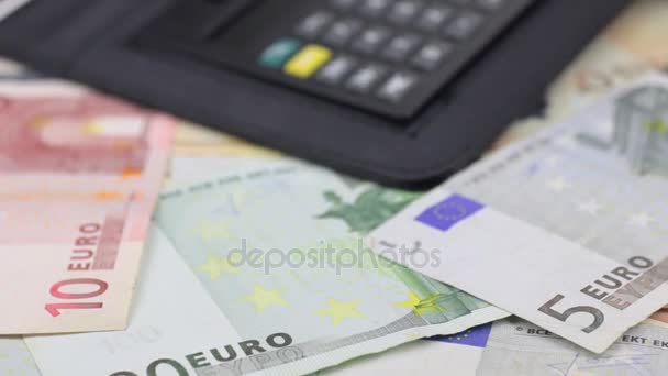 Video of diary and pen lie on the euro. Dolly shot. Close-up. - Filmati, video
