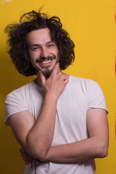 young man with funny hair over color background - Φωτογραφία, εικόνα
