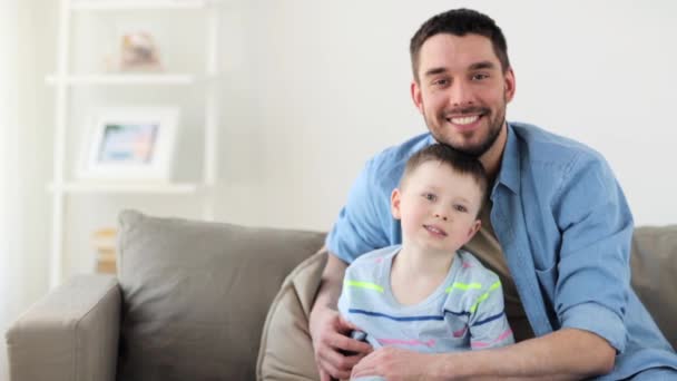happy father and little son hugging at home - Filmagem, Vídeo