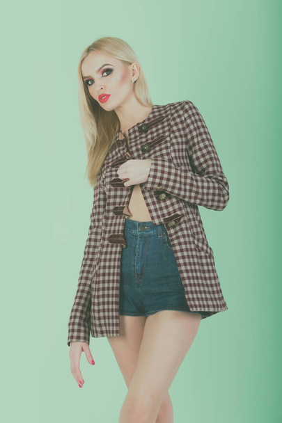 beautiful woman with makeup in fashionable shorts and jacket - 写真・画像