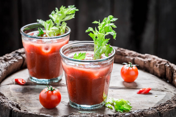 Spicy bloody mary cocktail with tomatoes and celery - Zdjęcie, obraz