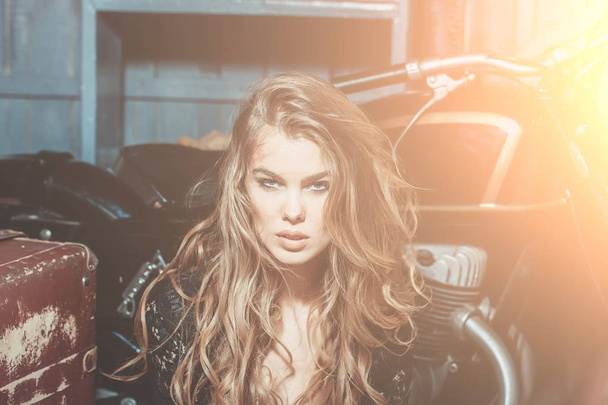 Sexy fashion model sitting at metallized motorcycle - Photo, image