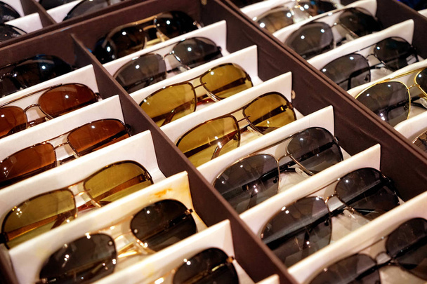 Showcase with different sunglasses - Foto, afbeelding