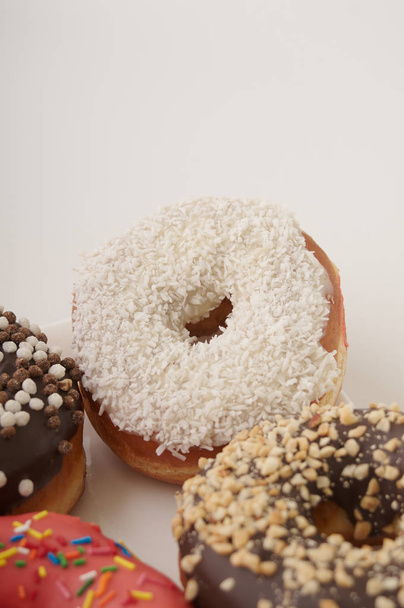 donuts on a plate on a white background - Foto, imagen