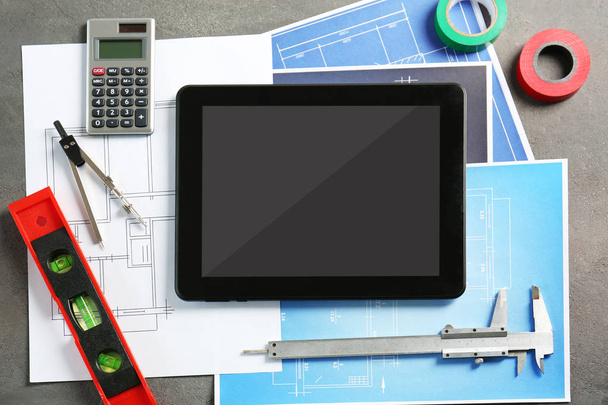 Engineering supplies, tablet and blueprints - Фото, изображение