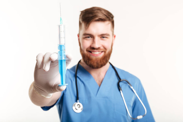 Portrait of a happy attractive medical doctor or nurse - Fotoğraf, Görsel