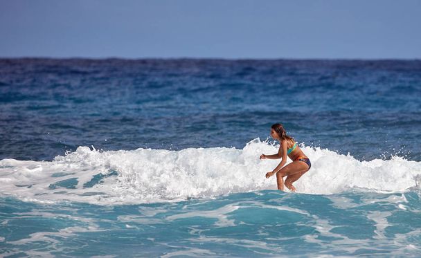 Surfer school. Beautiful young woman in swimsuit. Surfer on the wave - Φωτογραφία, εικόνα