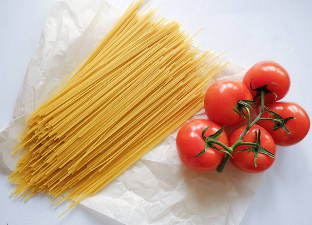 Pasta spaghetti with fresh vegetables red tomatoes   - Photo, Image