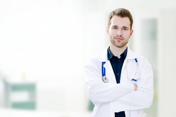 Handsome young doctor in office - Photo, image