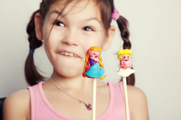 Girl playing puppet theater from clay - Photo, Image
