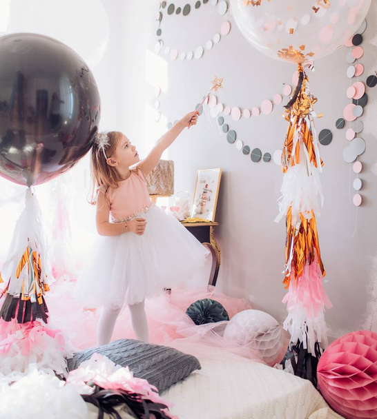 little girl  in room at Birthday party.  - Photo, image
