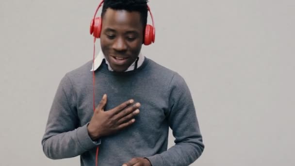 African american man listen music with headphones - Felvétel, videó