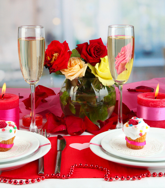 Table setting in honor of Valentine's Day on room background - Фото, изображение