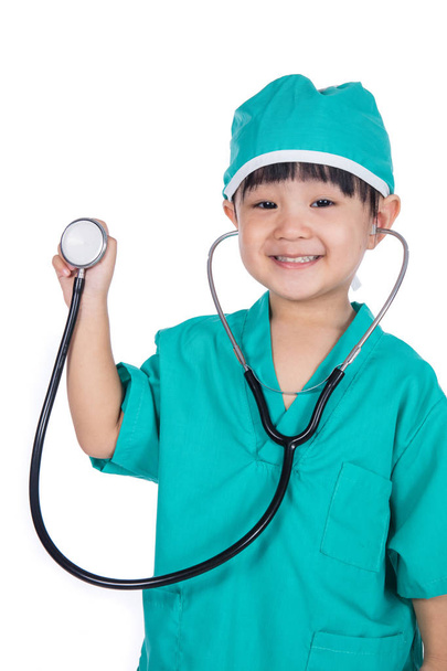 Asian Little Chinese Girl Playing Doctor with a stethoscope - 写真・画像