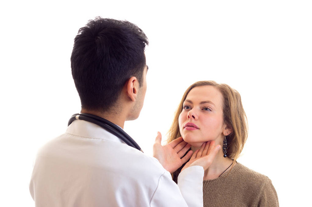 Doctor examing his patient - Фото, изображение