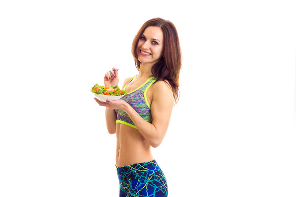 Sportive woman holding salad - Photo, Image