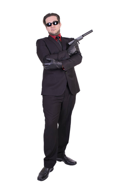 Hombre guapo sosteniendo el arma
 - Foto, Imagen