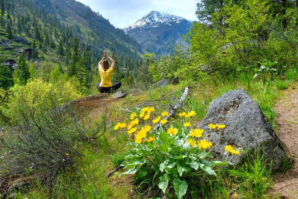 Woman meditating in nature. - Photo, Image