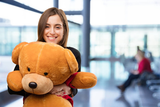 young pretty woman with teddy bear - Foto, afbeelding