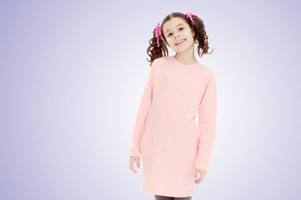 Beautiful little girl in a pink dress. - Foto, Imagen