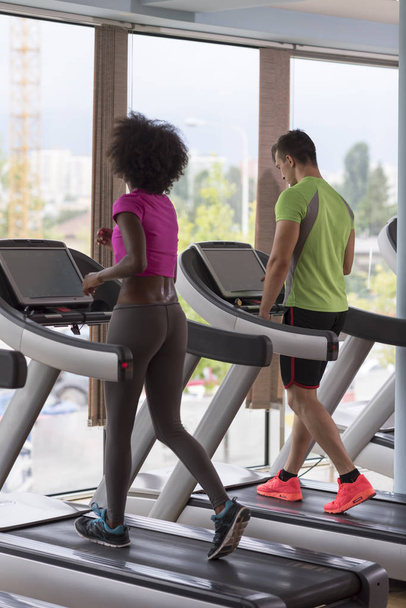 people exercising a cardio on treadmill  - Фото, зображення