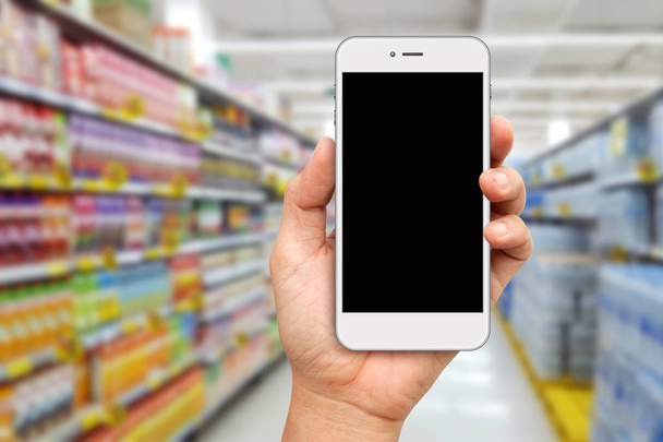 Hand met wit Smartphone voor online shopping concept - Foto, afbeelding