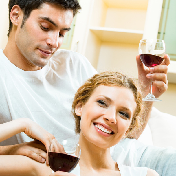 Cheerful couple with glasses of redwine - Fotografie, Obrázek