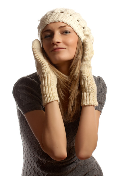 Young beautiful smiling girl in winter clothes over the white ba - Photo, Image