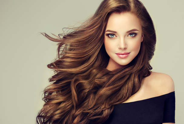 girl with long  and   shiny wavy hair - Photo, Image