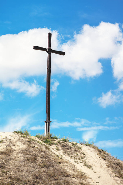 High wooden cross on the hill - Photo, image