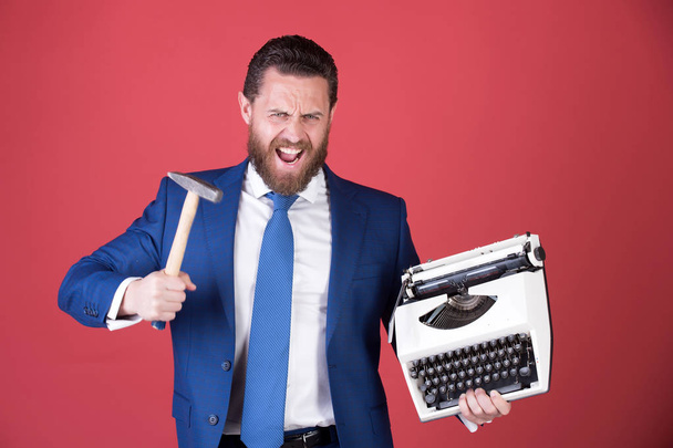 business man, aggressive businessman with typewriter and hammer - Foto, Imagem
