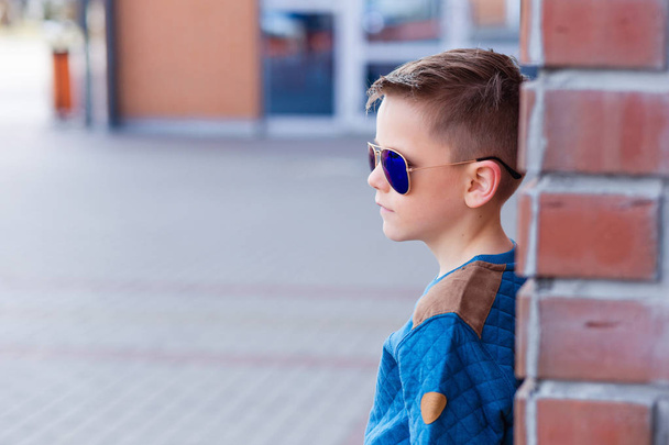 Portrait of a beautiful young boy outdoors - Photo, image