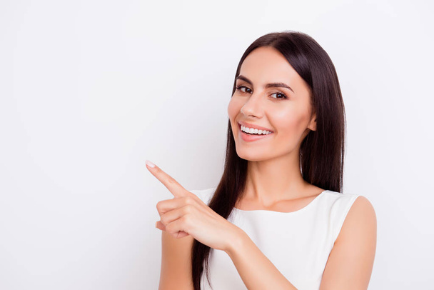 Successful smiling businesslady is pointing away with finger. Sh - Foto, Imagem