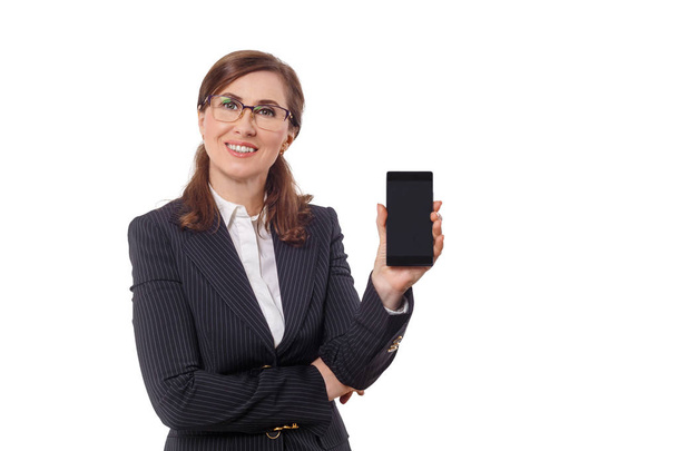 Portrait of a beautiful businesswoman 50 ears old with mobile phone isolated on white. - Foto, immagini