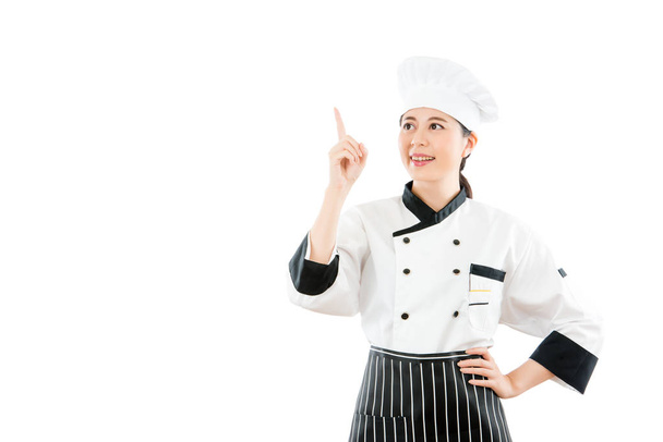 Woman chef pointing showing empty blank - Foto, Bild