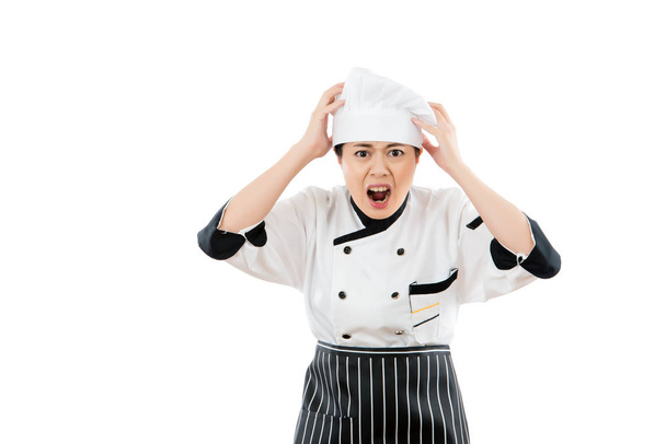 woman chef shocked and grab her head - Foto, afbeelding