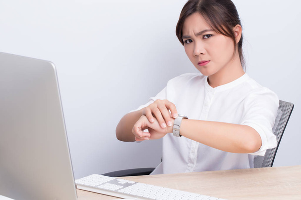 Angry woman checking time at office - Photo, Image