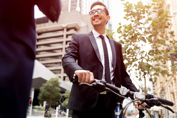 Young businessmen with a bike - Photo, image