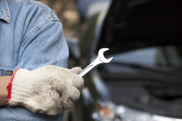 Car technician holding the wrench - Photo, Image