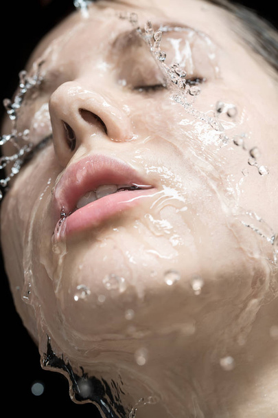 Water splashes on womans face - Φωτογραφία, εικόνα