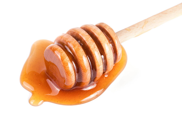 Μέλι ραβδί με ρέει μέλι απομονωθεί σε λευκό φόντο - Φωτογραφία, εικόνα