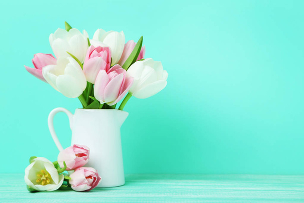 Bouquet of tulips in jug - Фото, изображение