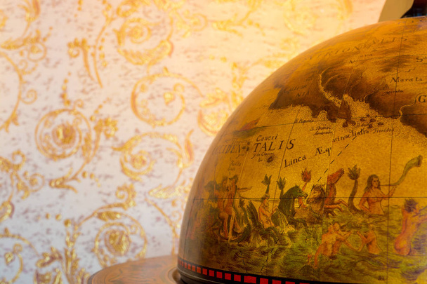 Photo of an retro globe on brown background - Photo, Image