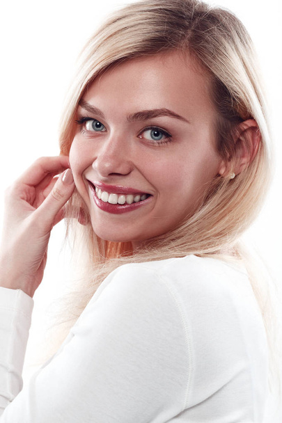 Beautiful woman smiling face close up studio on white. - Fotó, kép