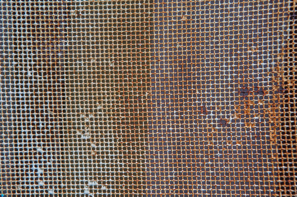 Old rusty mesh in blurring. Colorful pattern. - Photo, Image