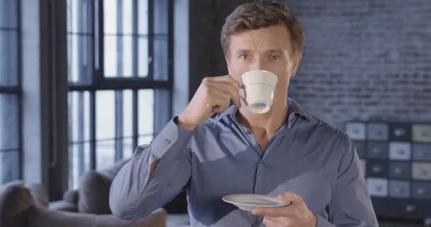 Slow Motion Portrait of Successful Businessman Drinking Tea Smiling. Businessman Series. 4K UHD 4096x2160. - Video